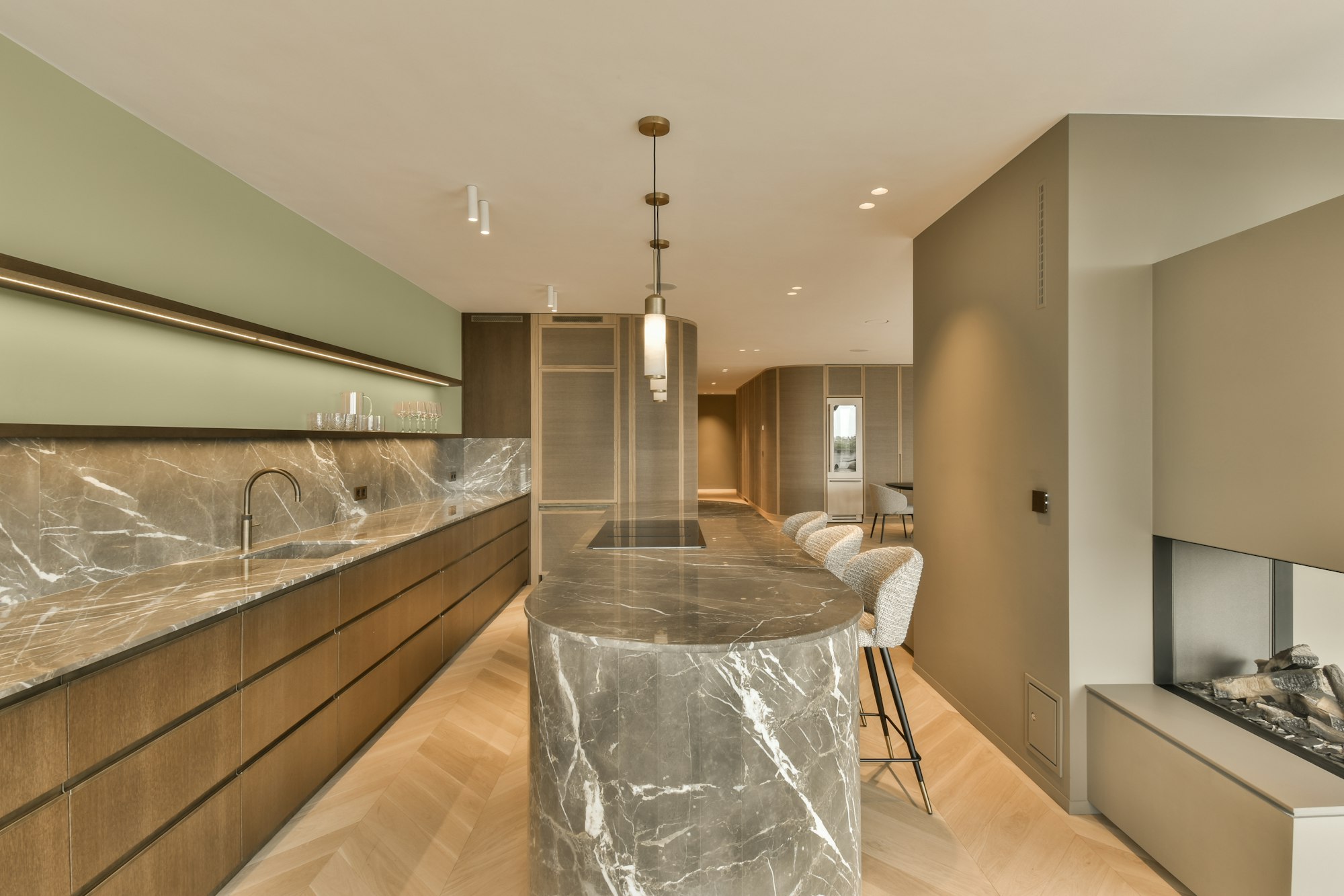 a kitchen with marble countertops and a long island