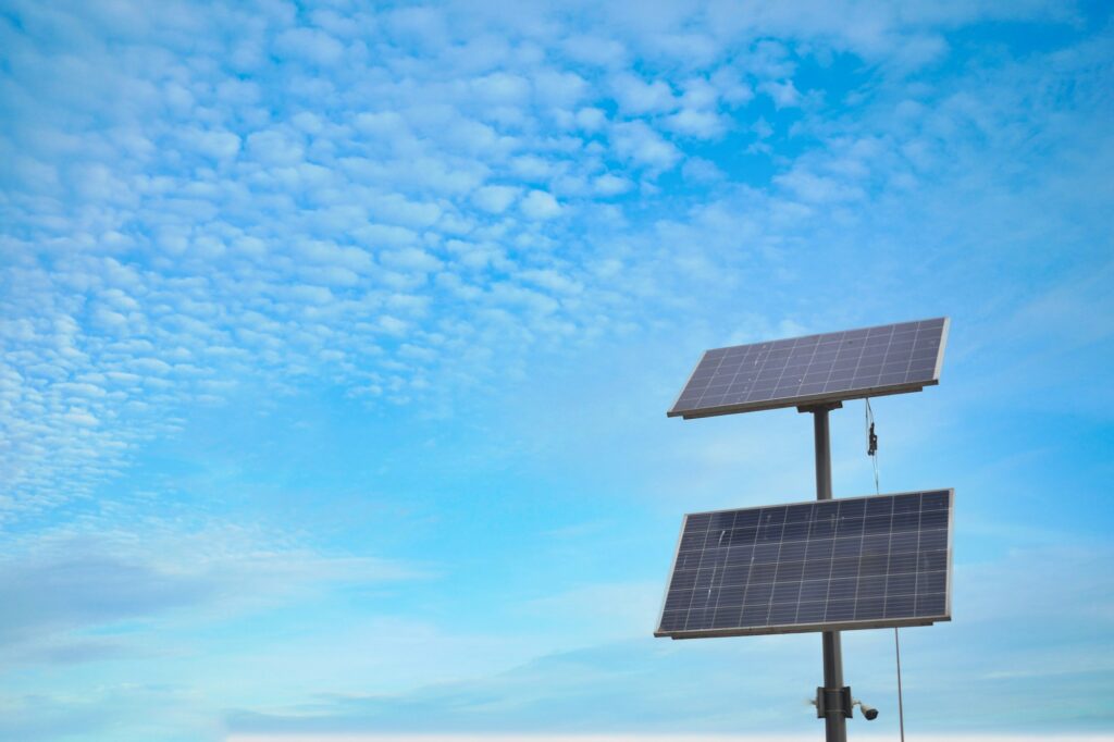 Solar pannels at street against blue sky