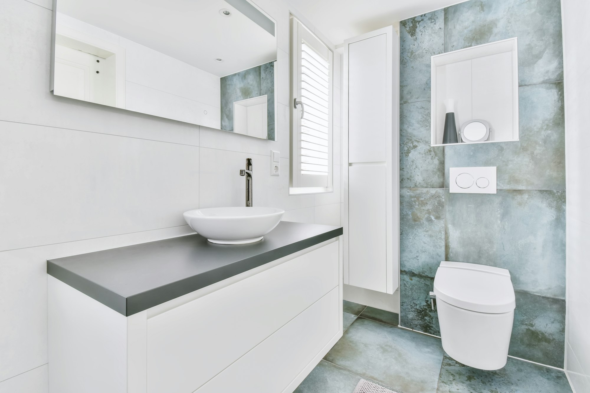 Stylish bathroom with large marble tiles