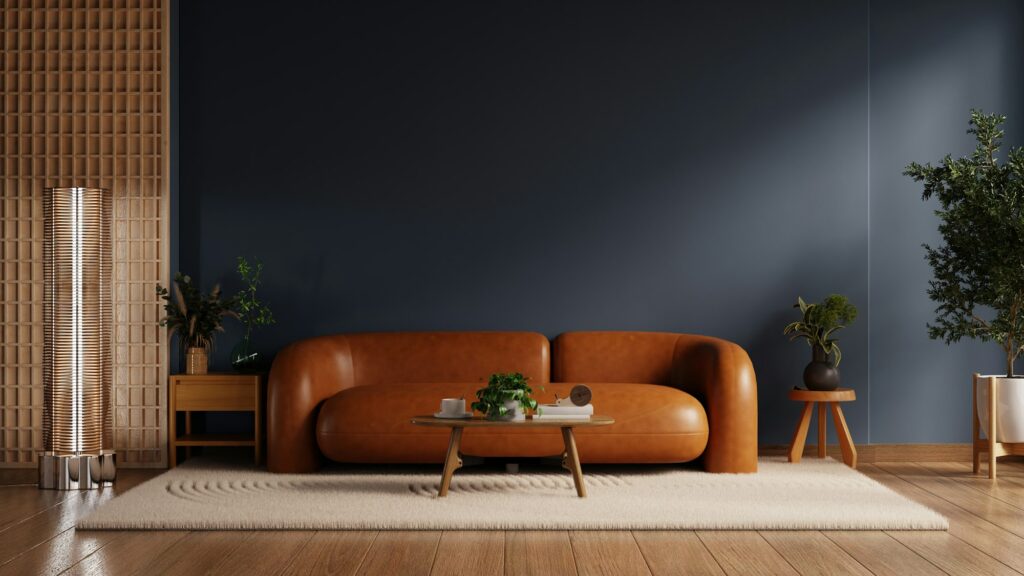 Living room features a sophisticated design with a rich dark blue accent wall